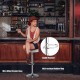 Adjustable white PU leather swivel barstool with chrome footrest, perfect for kitchen or bar seating.