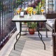 Black steel square table with tempered glass top, perfect for outdoor patios, featuring umbrella hole and stylish.