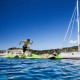 Floating water pad in vibrant green, made of durable XPE foam, perfect for fun and relaxation on lakes and beaches.