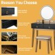 Makeup vanity table set in black with round LED mirror, four drawers, and solid wood legs for elegant storage solutions.