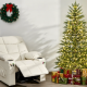 Beige kids recliner chair beside a 6.5FT pre-lit Christmas tree, perfect for cozy holiday gatherings.