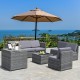 Gray 8-piece wicker sofa rattan dining set with storage table and cushions, ideal for outdoor patio relaxation.
