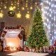 7 ft hinged Christmas tree with PVC branch tips and warm white LED lights, beautifully decorated for the holiday season.