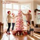 6 FT artificial pink Christmas tree with 460 branch tips, ideal for holiday decor in a cozy living room setting.