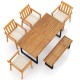 Top view of a 63” rectangular patio dining table set with four acacia wood armchairs and a backless bench for outdoor.
