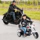 Chopper style 6V powered toddler 3-wheel motorbike in black and white, featuring a horn and headlight for fun rides.