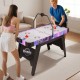 56-inch air hockey table with LED scoreboard, featuring two players in action, perfect for family fun and stability.