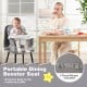Portable dining booster seat in grey with adjustable straps, perfect for bringing babies to the restaurant table.