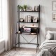 Freestanding black laptop desk with open shelves, spacious desktop, and heavy-duty metal frame for home office use.