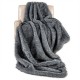 Gray 740GSM soft plush fuzzy luxury faux wolf fur blanket draped over a chair, ideal for sofas and cozy relaxation.