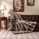 Luxury faux fox fur blanket in brown, featuring a soft texture, perfect for sofas and cozy relaxation.