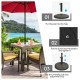 Patio market umbrella base stand with rattan design, durable resin, and adjustable knob for stability by poolside.