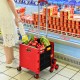 Foldable red utility cart with adjustable handle and tri-wheels, ideal for shopping and transporting goods.