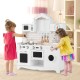 Wooden kids kitchen playset featuring a washing machine, oven, and gas stoves, designed for creative play and learning.