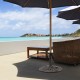 Round umbrella base stand made of premium cast iron in classic bronze, providing stability for patio umbrellas outdoors.