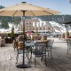 Heavy-duty 30lbs umbrella base with decorative pattern, bronze finish, and rust-resistant steel for outdoor use.