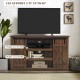 Sliding barn TV stand in brown with black metal rail, accommodates TVs up to 60", features rustic sliding doors.