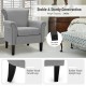 Detail view of adjustable foot pads and rubber wood legs on light gray upholstered accent chair, ensuring stability on.