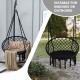 Cushioned black hammock swing chair with inclined backrest and tassels, suitable for indoor or outdoor relaxation.