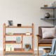 Four-tier bamboo storage shoe rack with slatted design, ideal for entryway or hallway organization.