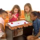 Kids enjoying the 2 in 1 In/Outdoor Air Hockey Foosball Game Table, featuring rotating surfaces for versatile play.