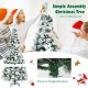 6-foot snow-flocked Christmas tree with white berries and poinsettia flowers, featuring a hinged design for easy.