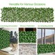 Expandable faux ivy privacy screen panel with white flowers, ideal for decoration and sun shading in various settings.