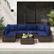 Sectional patio sofa set with navy cushions, featuring PE rattan and a glass coffee table, ideal for outdoor relaxation.