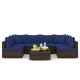Sectional sofa set with navy cushions, made of PE rattan, includes coffee table, ideal for patio and garden relaxation.