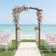 Wooden garden arch with floral decorations, ideal for weddings or outdoor events, made of durable fir wood.