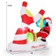 Santa with slingshot and gift boxes, 7 feet tall, LED lights, weather-resistant for outdoor Christmas decoration.