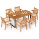 Top view of a 63” rectangular acacia wood dining table surrounded by six armchairs with removable cushions for outdoor.