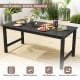 Black patio dining table made of all-weather HDPE, featuring a wood-like surface and ample 67” x 32” space for outdoor.