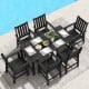 7-piece black patio dining set with HDPE table and chairs, featuring a large tabletop and rustic wood-like surface.