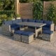 Close-up of the navy cushion on the ottoman from the 7-piece patio rattan dining set, designed for outdoor comfort.