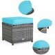 Turquoise cushion on a wicker ottoman from a 7-piece patio rattan dining furniture set for outdoor relaxation.