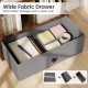 Wide fabric drawer in rustic brown bookshelf provides hidden storage while keeping items organized and easily.