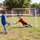 Children playing soccer with a 7 ft x 5 ft goal set featuring a removable target cloth for training accuracy.