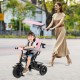 7-in-1 pink baby stroller tricycle with adjustable canopy, foldable footrests, and safety harness for ages 9-60 months.