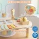Montessori sensory toy activity table with child-safe materials, featuring a music box, xylophone, and shape sorter.