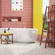 Teak utility bench and bamboo ladder shelf set, ideal for laundry supplies and towels in compact spaces.