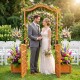 Garden arbor with gate and planter boxes, featuring rustic fir wood, ideal for outdoor weddings and climbing plants.