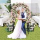 Garden arbor with lockable gate and side planters, featuring an arched top, perfect for weddings and outdoor decor.