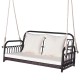 Wicker hanging porch swing with white cushions, 880 lbs capacity, ideal for outdoor relaxation in gardens or backyards.
