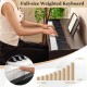 Full-size weighted keyboard with furniture stand, featuring dual speakers and triple pedals for realistic playing.