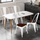 Single Tolix style metal dining chair with white frame and elm wood seat, offering ergonomic support and vintage charm.