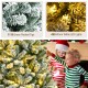 7-foot pre-lit snow flocked Christmas tree with 1116 tips and 450 warm white LED lights for festive holiday cheer.