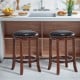 Backless swivel bar stools with padded PU leather seats and rubber wood legs, perfect for kitchen or bar use.