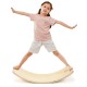 Child balancing on a wooden wobble balance board made of premium birch, promoting healthy posture and fun activities.