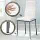 White PVC leather dining chair with a soft cushion, featuring a sturdy structure for modern dining rooms.